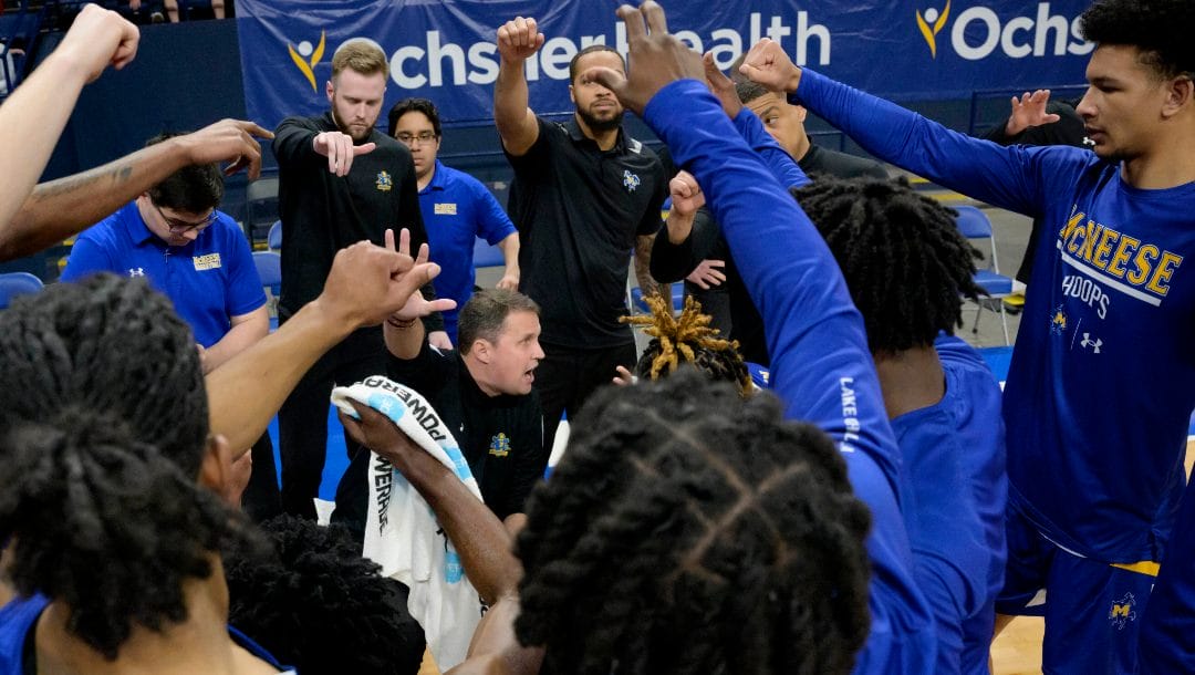 McNeese coach Will Wade, center, talks to the team during a timeout in an NCAA college basketball game against New Orleans in New Orleans, Wednesday, March 6, 2024. Wade was suspended for the first 10 games of the 2023–24 season by the NCAA but the team went to a 28-3 record and finished first in the Southland Conference.
