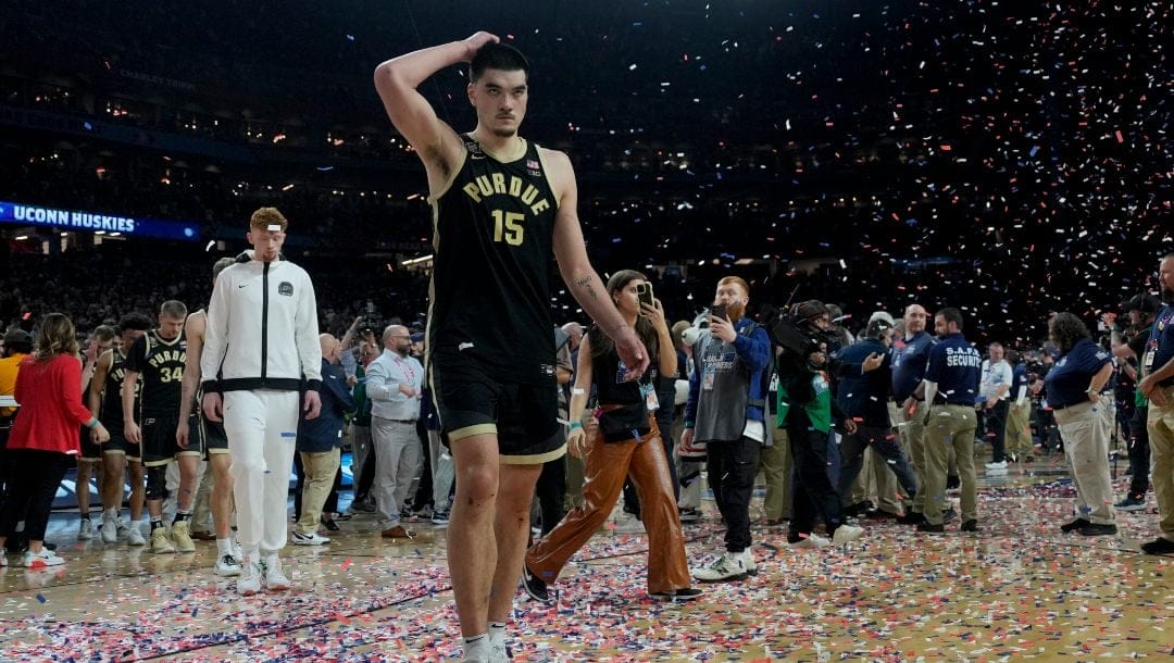 Purdue center Zach Edey (15) leaves the courier their loss against UConn in the NCAA college Final Four championship basketball game, Monday, April 8, 2024, in Glendale, Ariz.