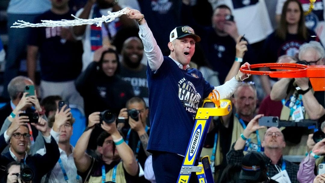 UConn head coach Dan Hurley celebrates after the NCAA college Final Four championship basketball game against Purdue, Monday, April 8, 2024, in Glendale, Ariz.