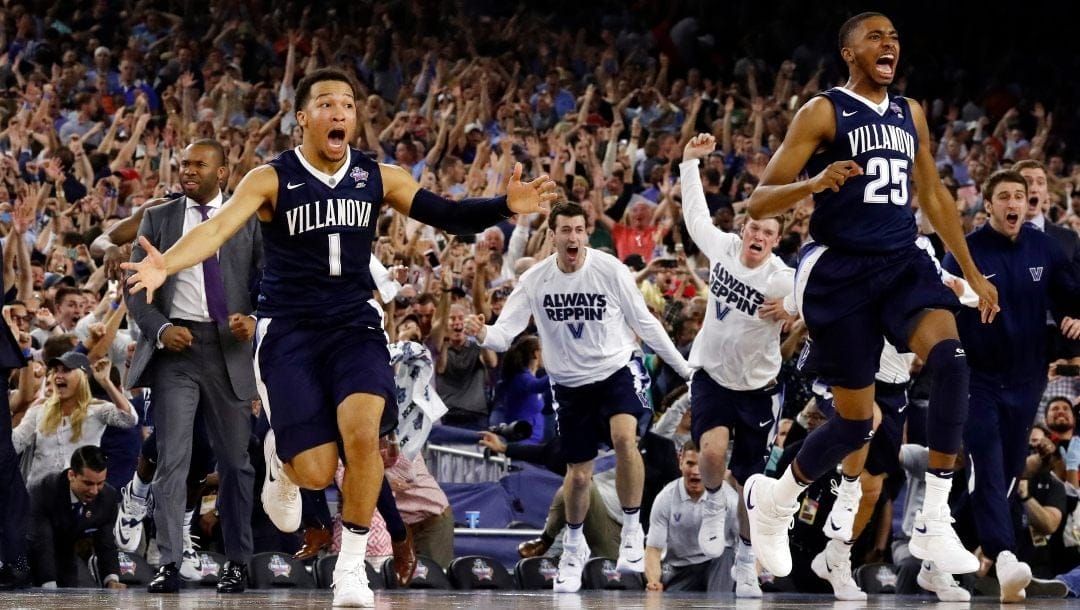 Villanova's Jalen Brunson (1), Mikal Bridges (25) and their teammates celebrate after the NCAA Final Four tournament college basketball championship game against North Carolina, Monday, April 4, 2016, in Houston. Villanova won 77-74.