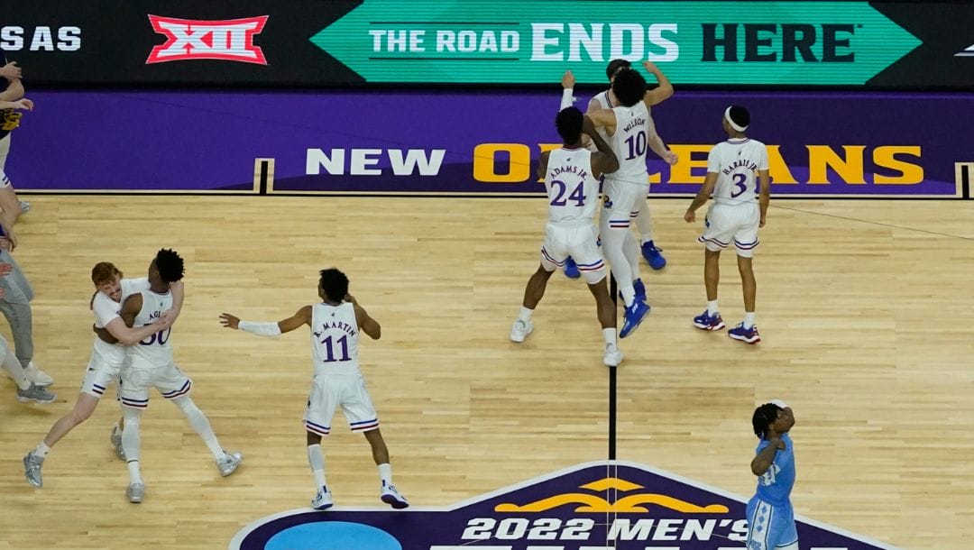 Kansas players celebrate after a college basketball game against North Carolina in the finals of the Men's Final Four NCAA.