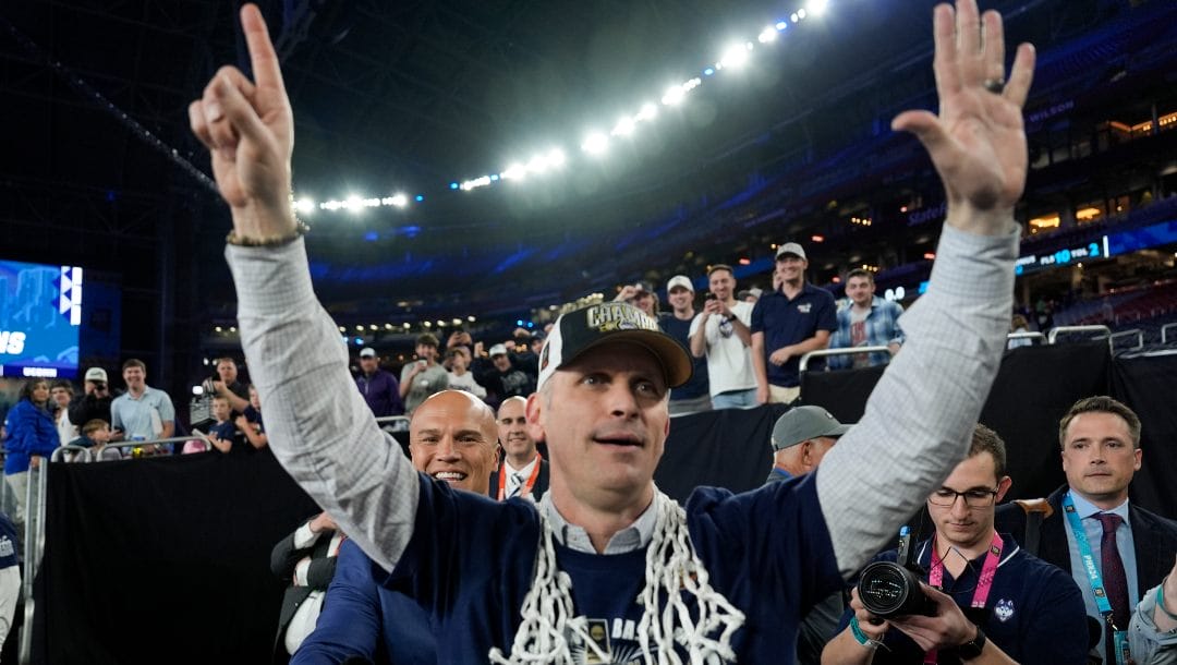 UConn head coach Dan Hurley greets fans after their win against Purdue in the NCAA college Final Four championship basketball game, April 8, 2024, in Glendale, Ariz.