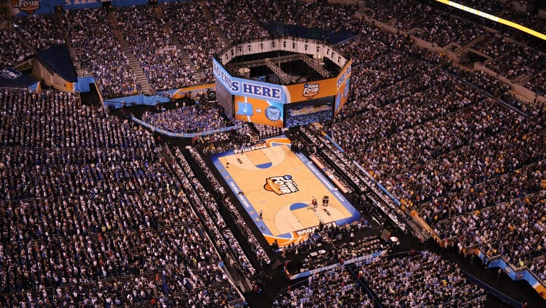 Butler players huddle in the Lucas Oil Stadium before the first half of the men's NCAA Final Four college basketball championship game between Butler and Duke Monday, April 5, 2010, in Indianapolis.