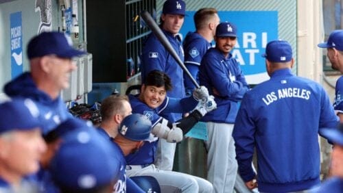 Los Angeles Dodgers' Shohei Ohtani in the dugout before a spring training baseball game against the Los Angeles Angels Tuesday, March 25, 2025, in Anaheim, Calif.