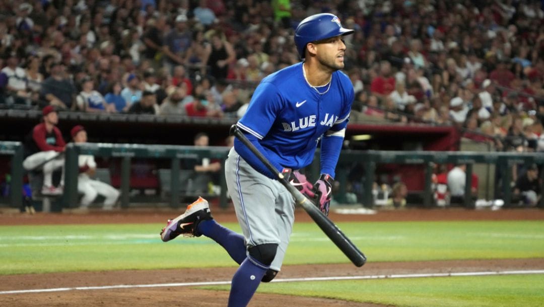 Toronto Blue Jays outfielder George Springer (4) hits against the Arizona Diamondbacks in the first inning during a baseball game.