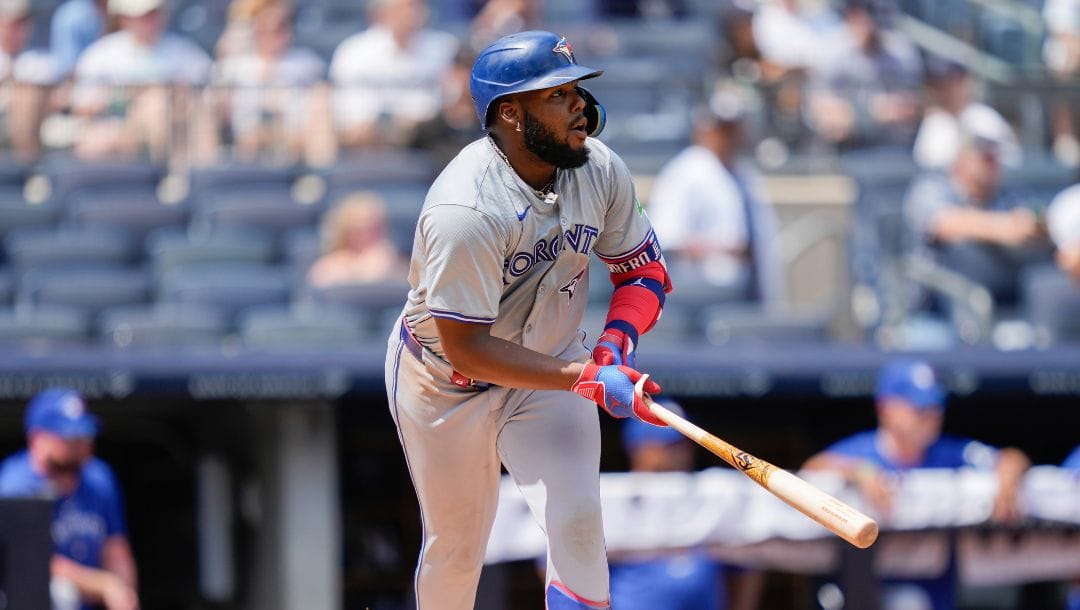 Toronto Blue Jays' Vladimir Guerrero Jr. singles on a line drive during the fourth inning of a baseball game against the New York.