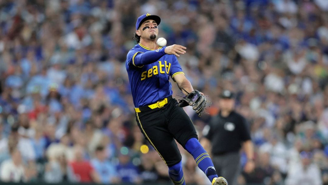 Seattle Mariners third baseman Josh Rojas throws out Toronto Blue Jays' Bo Bichette at first during the ninth inning.