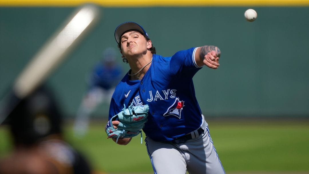 Toronto Blue Jays pitcher Ricky Tiedemann throws in the fifth inning of a spring training baseball game against the Pittsburgh.