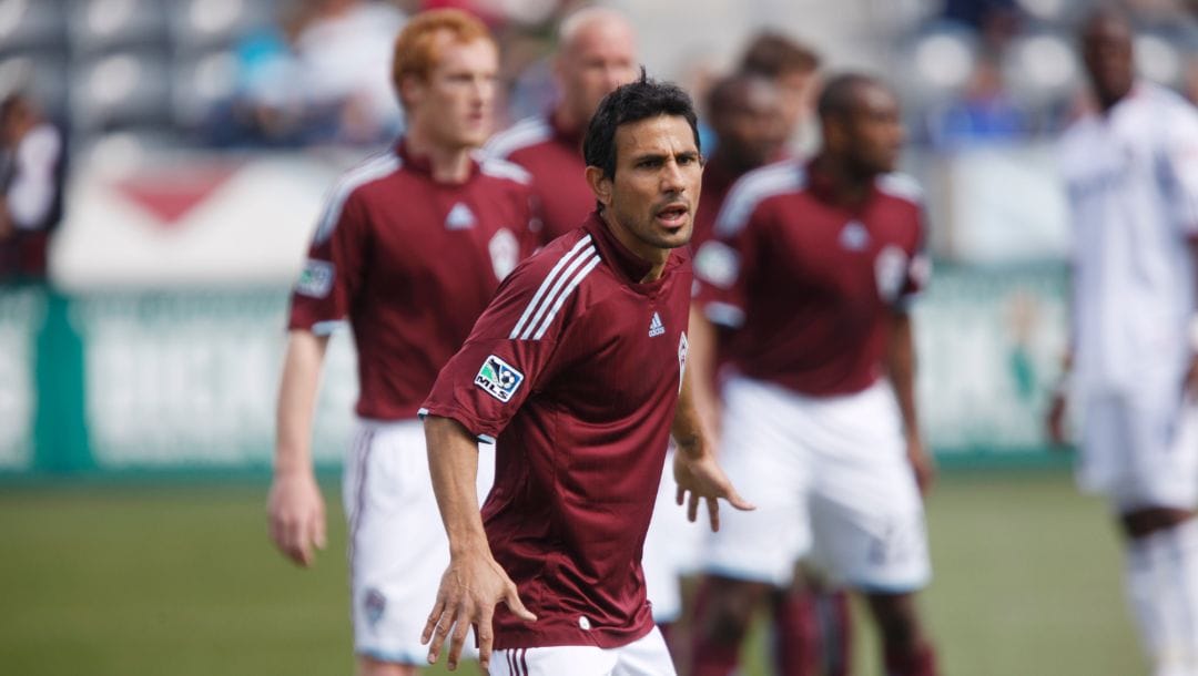 Colorado Rapids midfielder Pablo Mastroeni looks on while facing the Chicago Fire in the first half of an MLS soccer game.