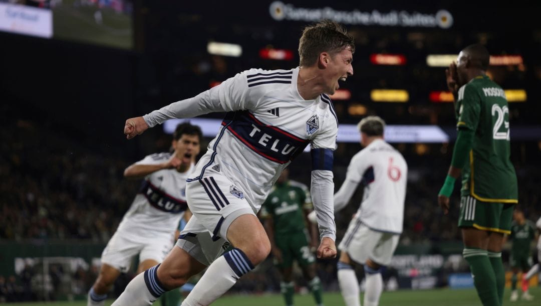 Vancouver Whitecaps midfielder Ryan Gauld scores a goal during the first half of an MLS soccer match against the Portland Timbers.