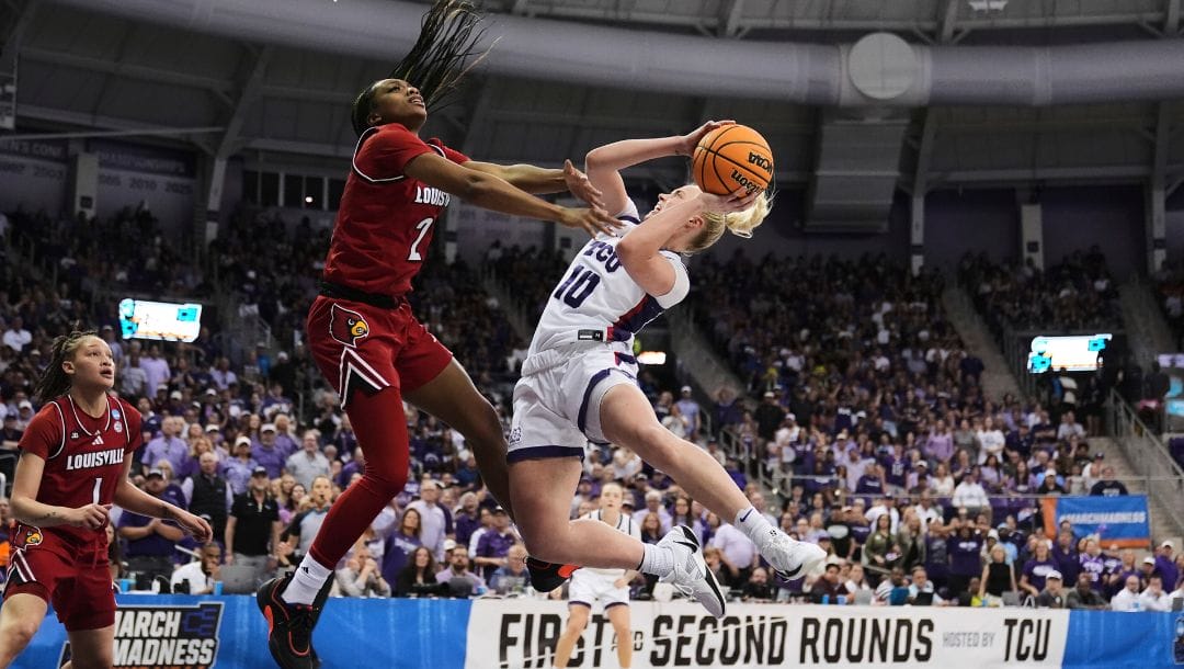 TCU guard Hailey Van Lith (10) shoots as Louisville's Nyla Harris (2) and Imari Berry (1) defend in the second half.