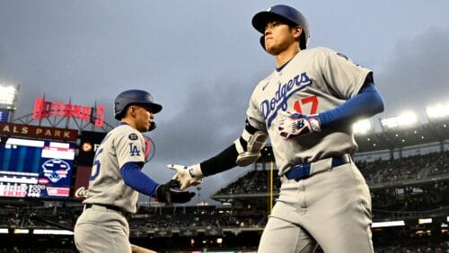 Los Angeles Dodgers designated hitter Shohei Ohtani (17) celebrates with Tommy Edman, left, after his two-run home run during the third inning of a baseball game against the Washington Nationals, Monday, April 7, 2025, in Washington.