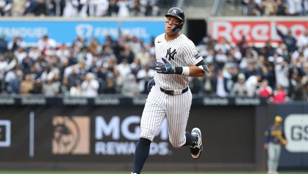 New York Yankees' Aaron Judge runs to home plate after hitting a two-run home run during the first inning of a baseball game against the Milwaukee Brewers, Sunday, March 30, 2025, in New York.