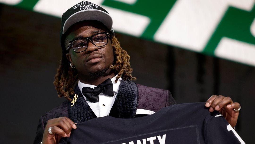 Boise State running back Ashton Jeanty reacts after being chosen by the Las Vegas Raiders with the sixth overall pick during the first round of the NFL football draft Thursday, April 24, 2025, in Green Bay, Wis.