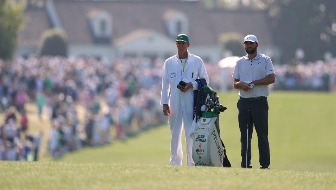 Scottie Scheffler waits to hit on the first hole during the first round at the Masters golf tournament, Thursday, April 10, 2025, in Augusta, Ga.