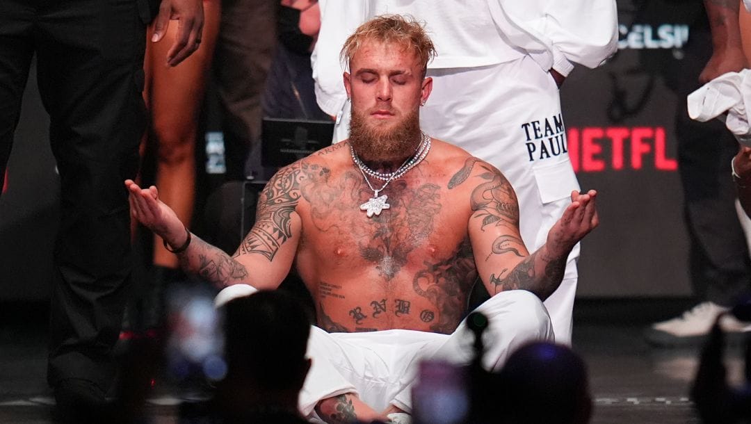 Jake Paul reacts during a weigh-in ahead of his heavyweight bout against Mike Tyson, Thursday, Nov. 14, 2024, in Irving, Texas.