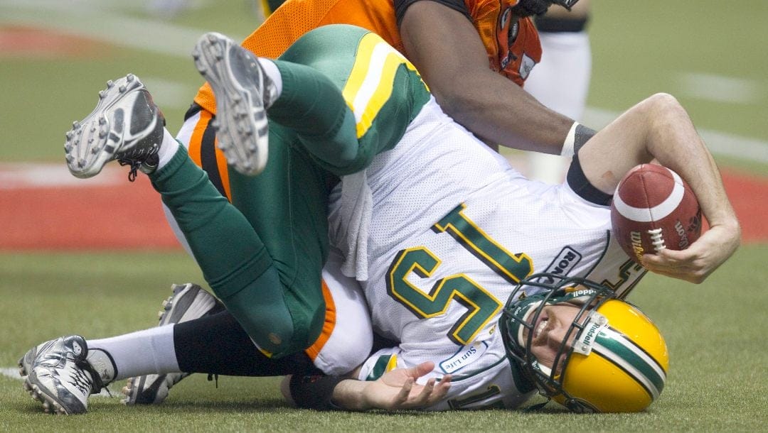 B.C. Lions' Khalif Mitchell sacks Edmonton Eskimos' quarterback Ricky Ray during the second quarter of the CFL Western Final football game in Vancouver, B.C., on Sunday November 20, 2011.