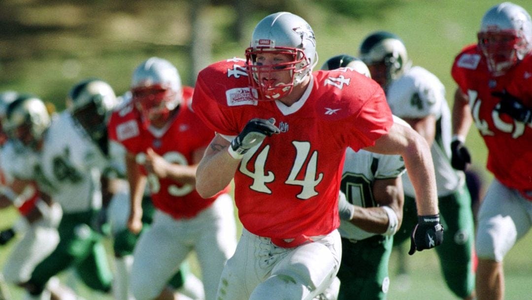 In this Nov. 6, 1999, file photo, New Mexico's Brian Urlacher (44) leads the charge downfield during punt coverage against Colorado State during an NCAA college football game at University Stadium in Albuquerque, N.M.
