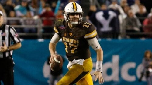 FILE - In this Dec. 21, 2016, file photo, Wyoming quarterback Josh Allen looks to throw against BYU during the second half.