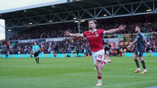 Wrexham's Sam Smith celebrates after scoring his side's third goal during the English League One soccer match between Wrexham and Charlton Athletic at the Racecourse ground in Wrexham, Wales, Saturday, April 26, 2025.