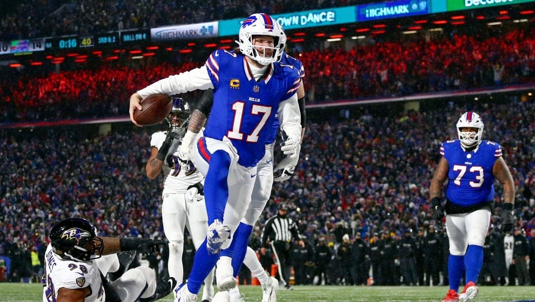 Buffalo Bills quarterback Josh Allen (17) runs into the endzone for a touchdown during to the first half of an NFL football divisional playoff game against the Baltimore Ravens in Orchard Park, N.Y., Sunday Jan. 19, 2025