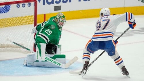 Edmonton Oilers center Connor McDavid (97) prepares to shoot against Dallas Stars goaltender Jake Oettinger (29) during overtime in Game 1 of the NHL hockey Western Conference Stanley Cup playoff finals, May 23, 2024, in Dallas.
