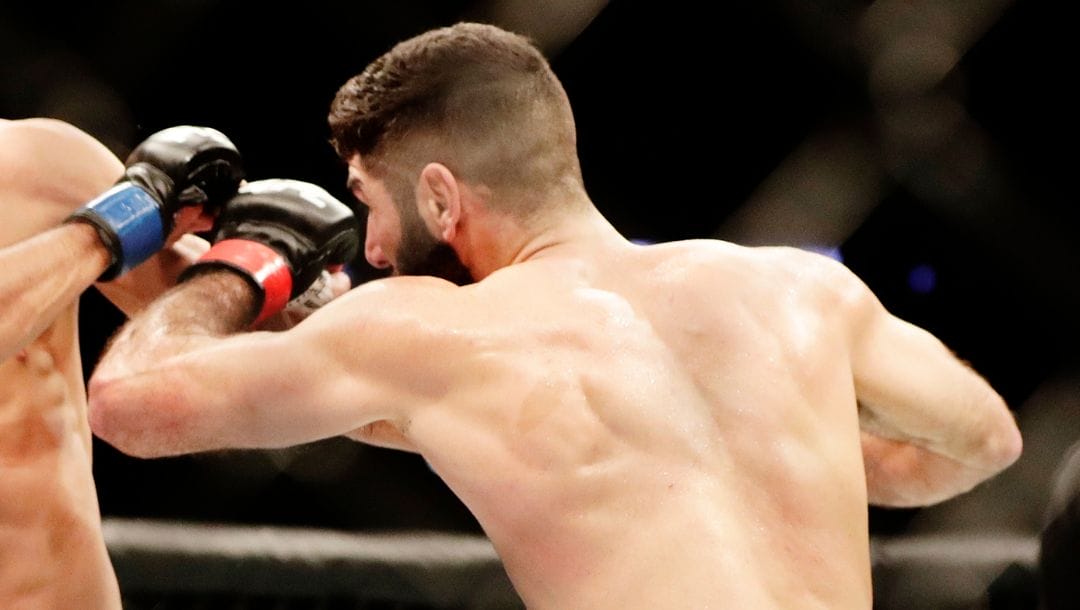 Ricardo Ramos, left, of Brazil, fights Aiemann Zahabi, of Canada, during a bantamweight mixed martial arts bout at UFC 217.