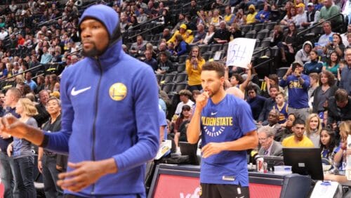 Stephen Curry and Kevin Durant practice prior to the start of a game in Denver, Colorado.