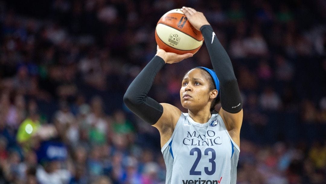 Minnesota Lynx player Maya Moore shoots a foul shot in a game against the Atlanta Dream