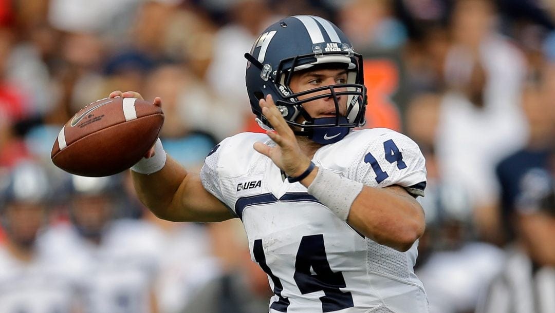 Old Dominion quarterback Taylor Heinicke throws to a receiver in the first half of an NCAA college football game against Maryland in College Park, Md., Saturday, Sept. 7, 2013.