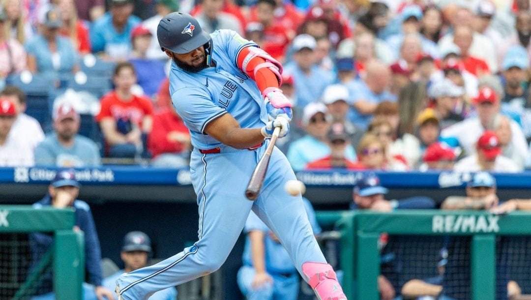 Toronto Blue Jays Vladimir Guerrero Jr. hits a single during the third inning of a baseball game against the Philadelphia Phillies, Saturday, June 14, 2025, in Philadelphia.