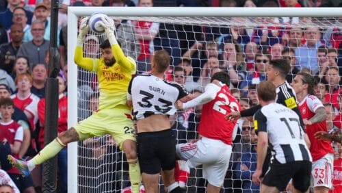 Arsenal's goalkeeper David Raya, left, makes a save during the English Premier League soccer match between Arsenal and Newcastle United at Emirates stadium in London, Sunday, May 18, 2025.