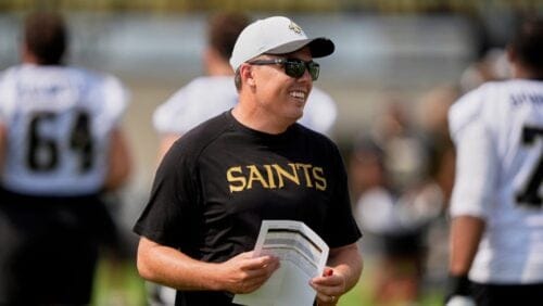 New Orleans Saints head coach Kellen Moore walks on the field during an NFL football training camp in Metairie, La., Thursday, July 24, 2025.